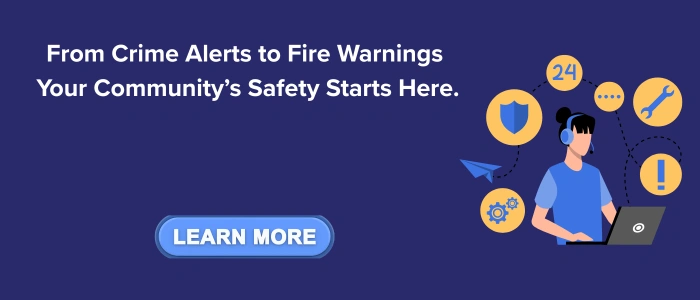 Community safety CTA banner with the message 'From Crime Alerts to Fire Warnings, Your Community’s Safety Starts Here.' On the right, an illustrated figure with a headset uses a laptop, surrounded by safety icons including a shield, gear, exclamation mark, wrench, and 24/7 service symbol. A blue button labeled 'Learn More' encourages user interaction.