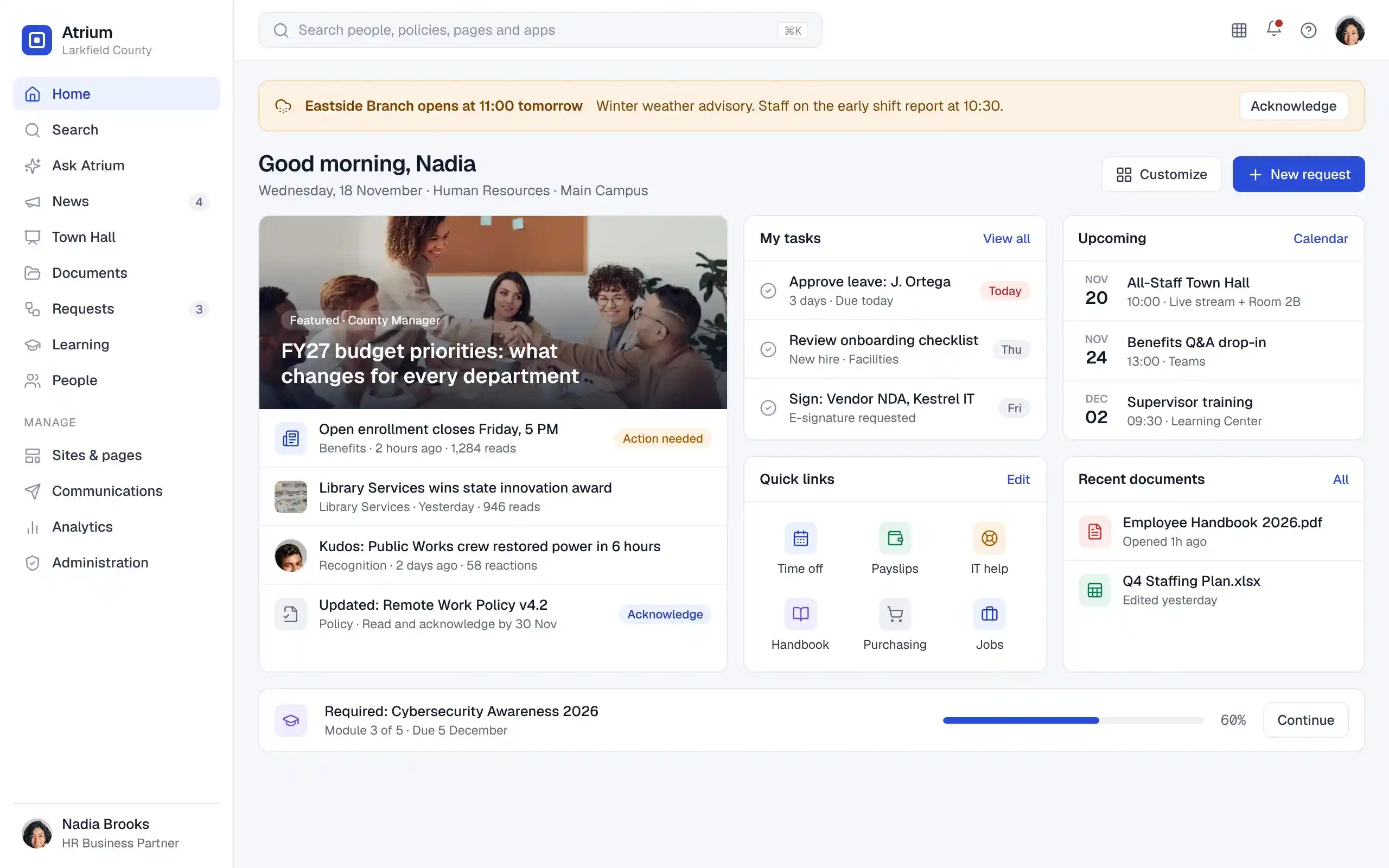 Atrium employee home page with a weather closure banner, featured news, tasks, upcoming events, quick links, recent documents and a required training module